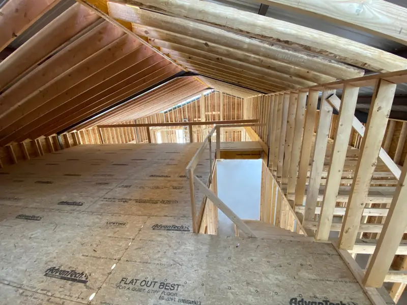 Stair opening and railing framed on the loft.