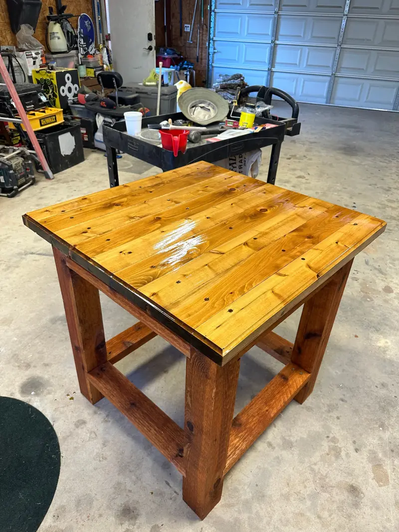 Finished table with a stained top and base.
