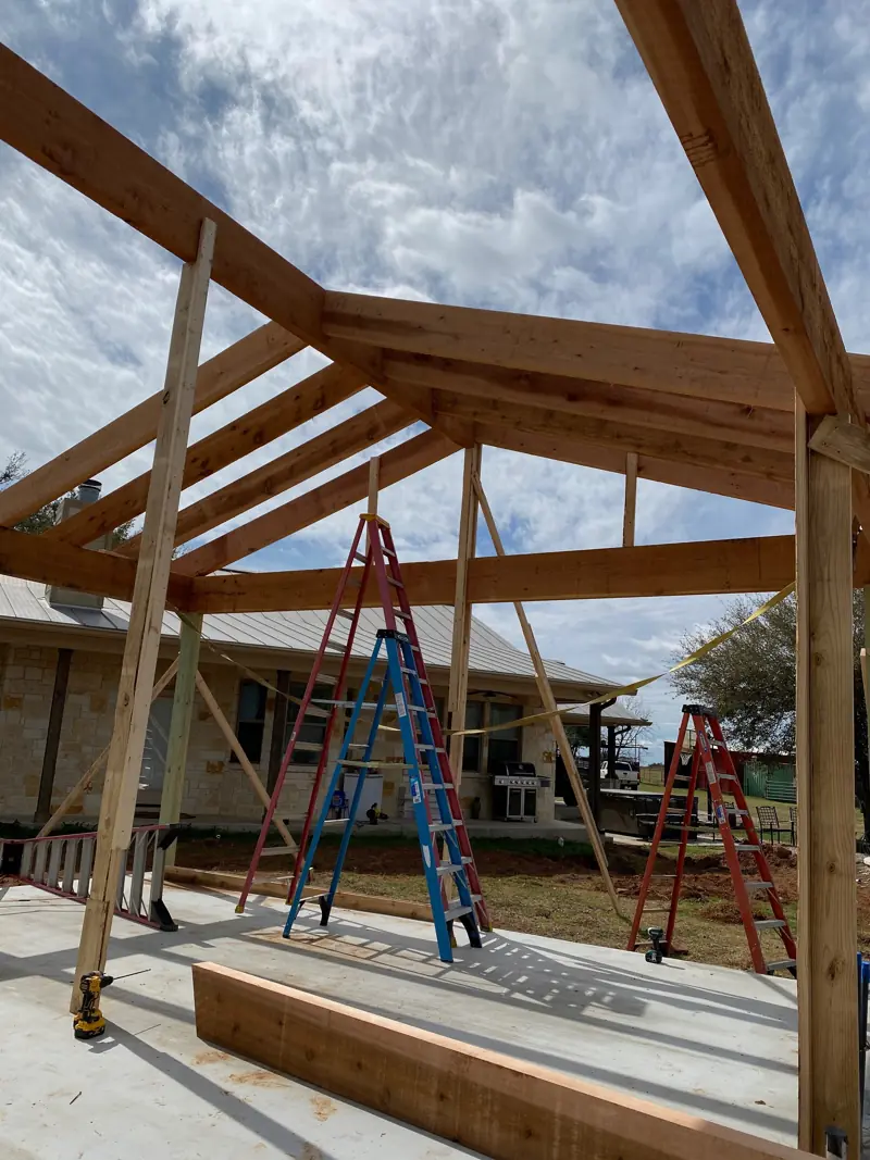 Cedar rafters and hip framing seen from below.