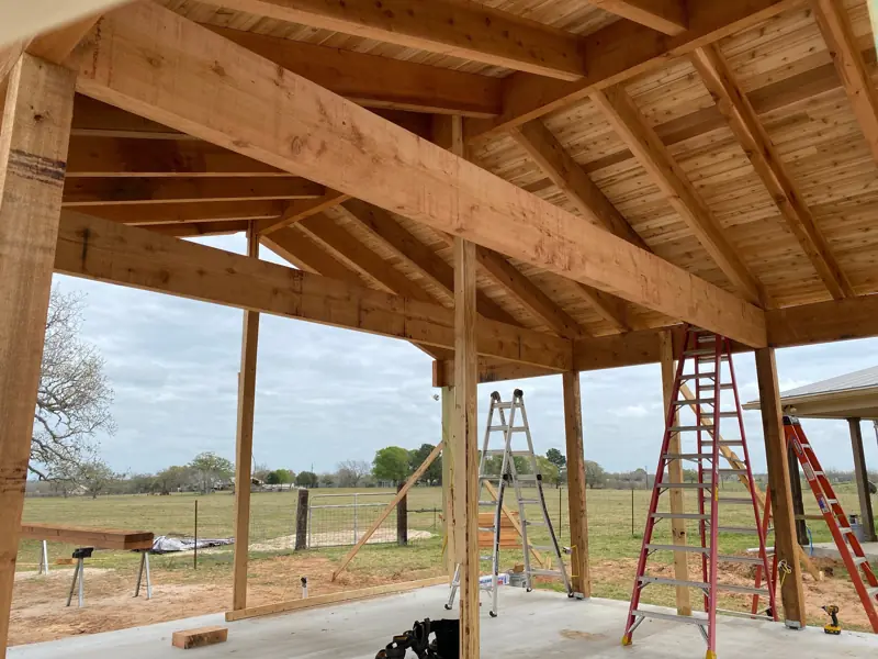 Cedar beams and ceiling with the pasture beyond.